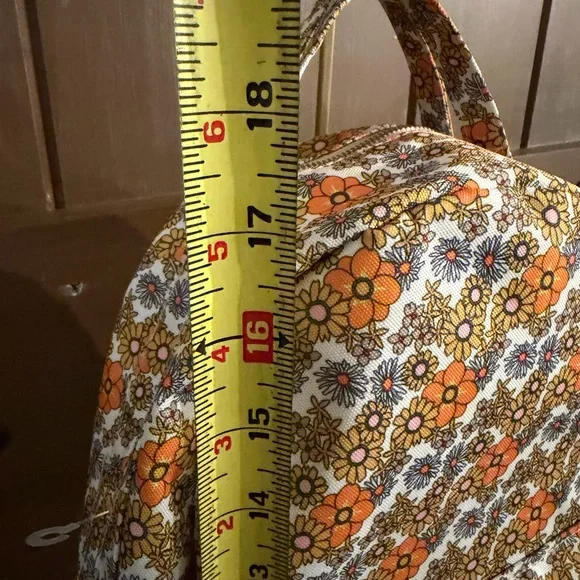 Add some color to your wardrobe with this Floral Orange and Yellow Backpack. - Picture 8 of 10